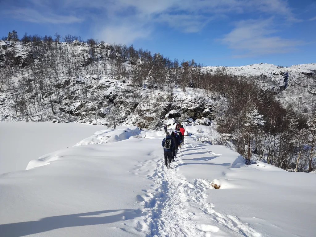 Snow-covered trail towards Preikestolen in Norway