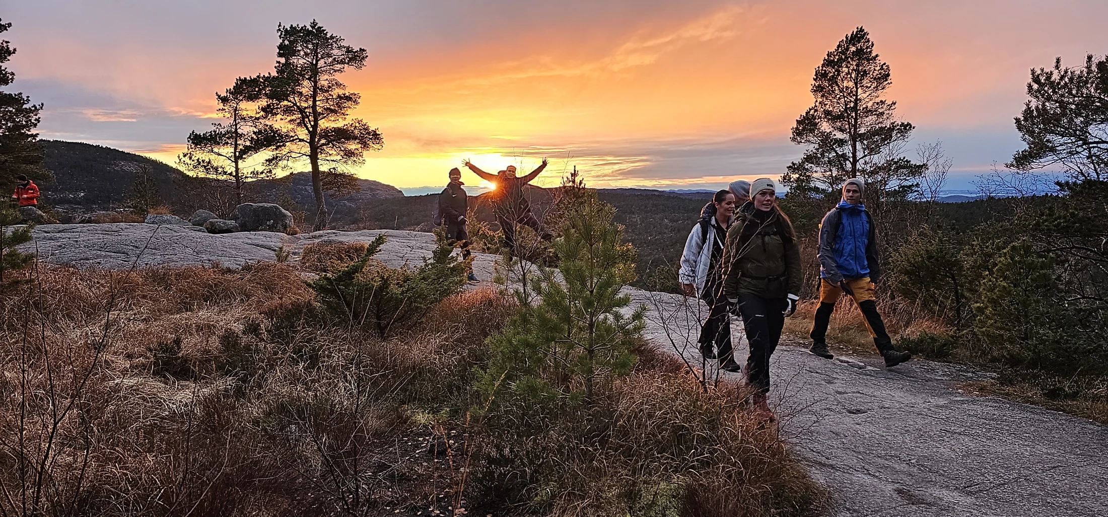 Corporate group near Preikestolen at sunset