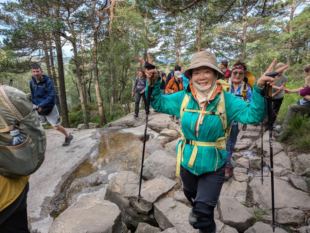 Guided hiker on the trail to Preikestolen, Norway