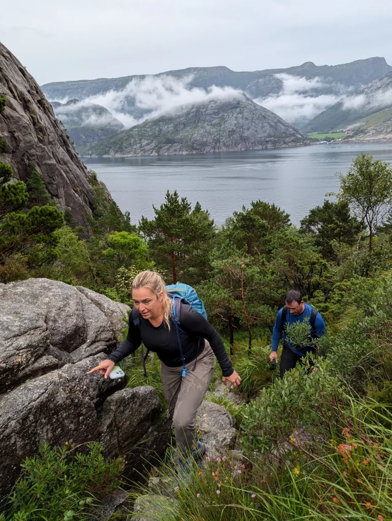 Couple hiking together on a private Preikestolen experience in Norway
